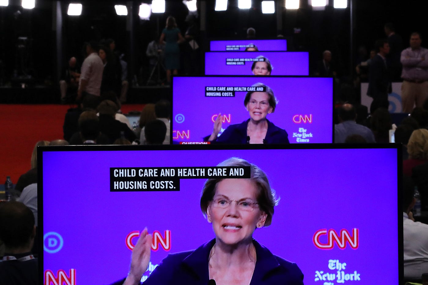 Sen. Elizabeth Warren (D-MA) appears on television screens in the Media Center during the Democratic Presidential Debate.