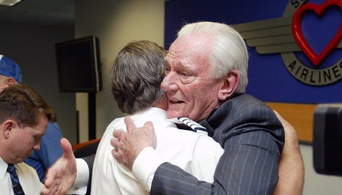 Herb Kelleher hugging a pilot
