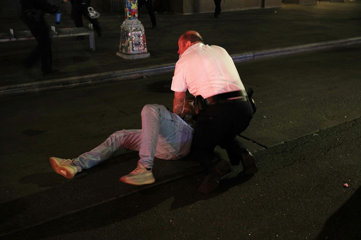 Police with man on the ground
