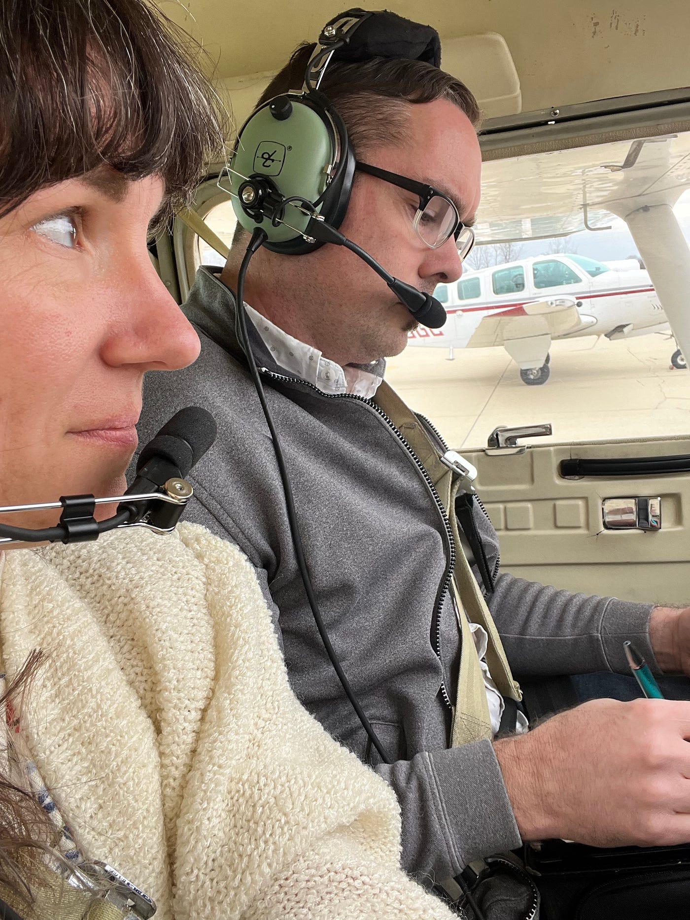 two people in a small plane cockpit