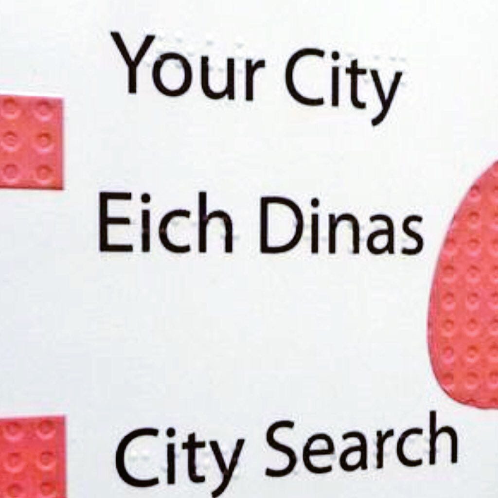 Welsh language panel with braille text overlaid as invisible raised text