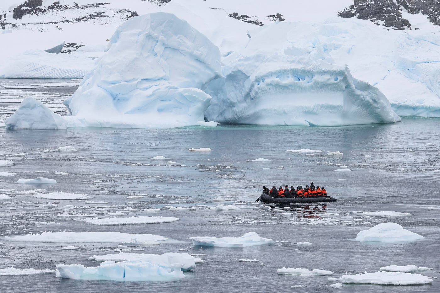 A zodiac inflatable boat navigates small growlers of ice to return to the ship from Station Y.