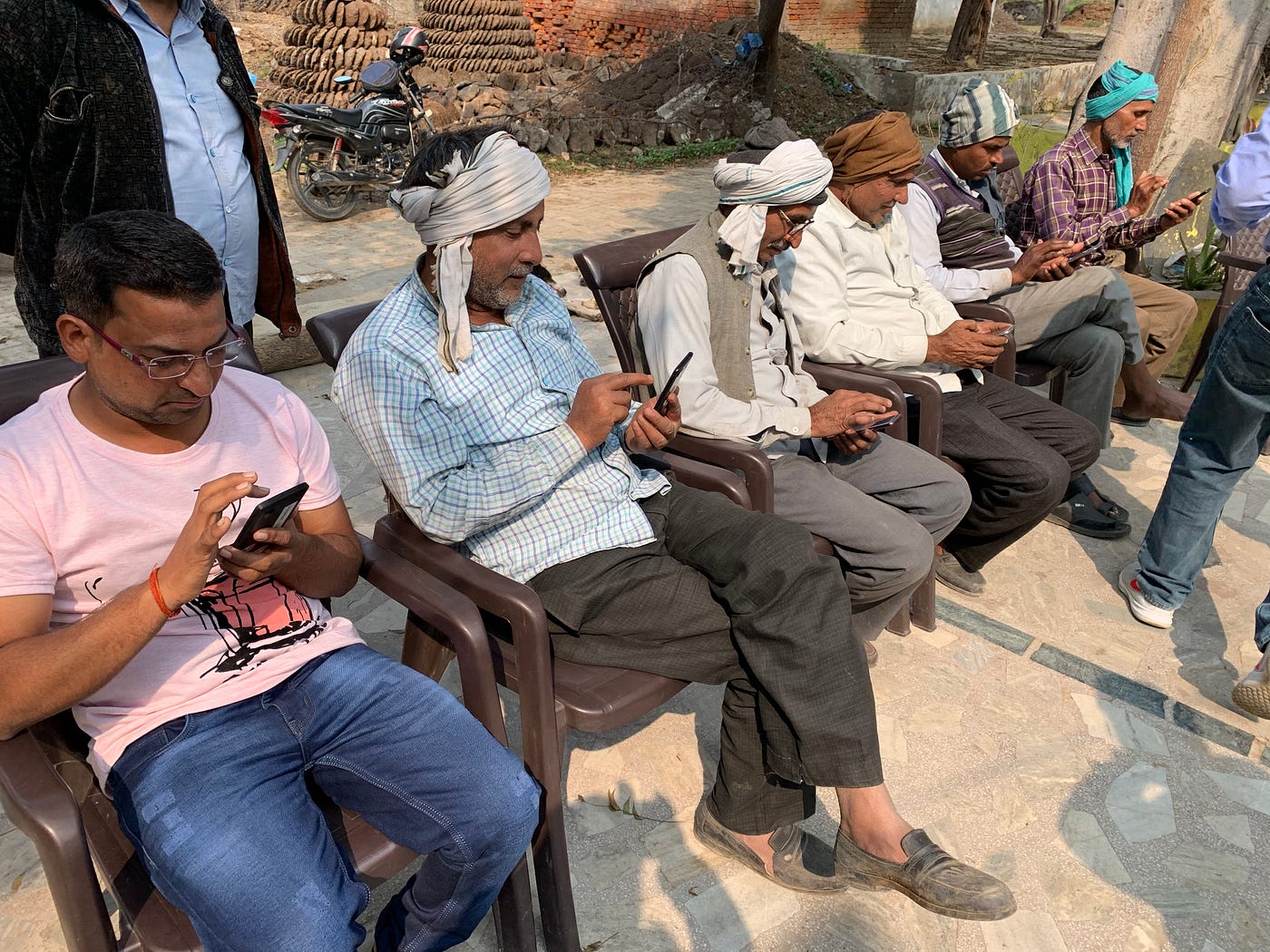 Farmers viewing articles on one of our apps to provide feedback on the content