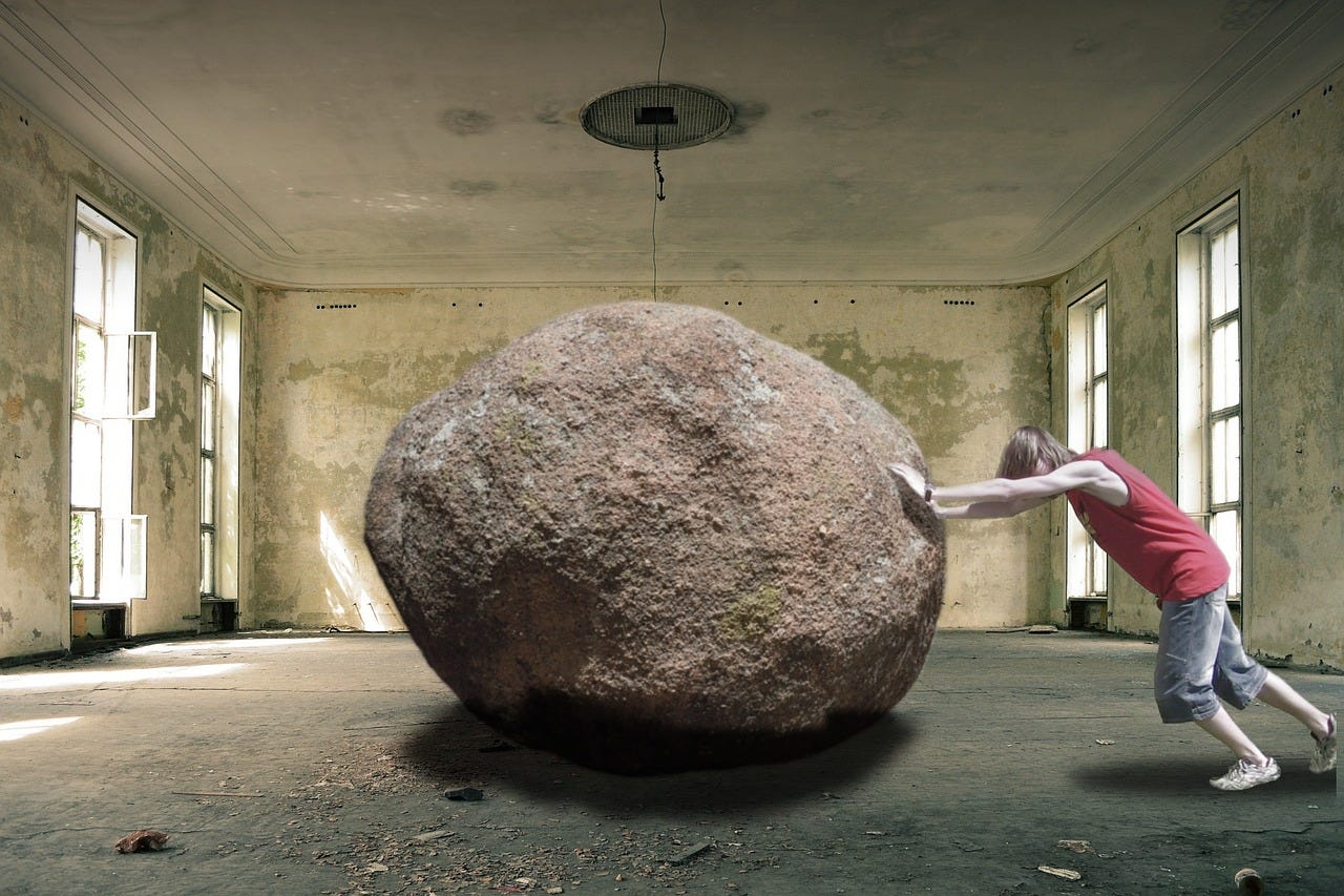 Pushing a boulder