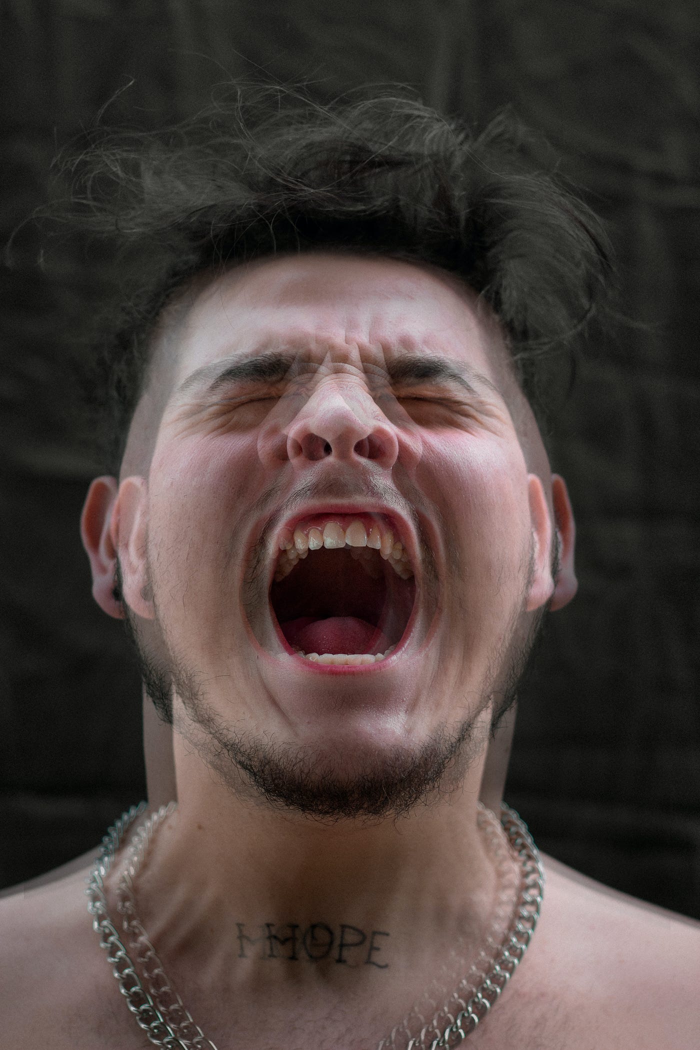 man screaming angry