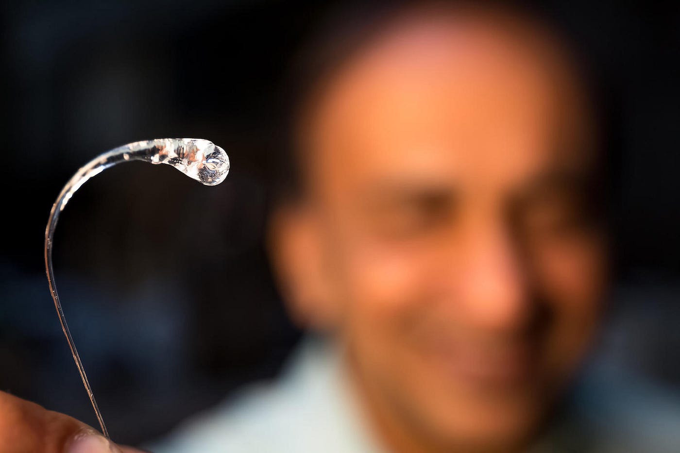 Srinivasan Chandrasekar displays a Prince Rupert’s drop. (Purdue University photo/Trevor Mahlmann)