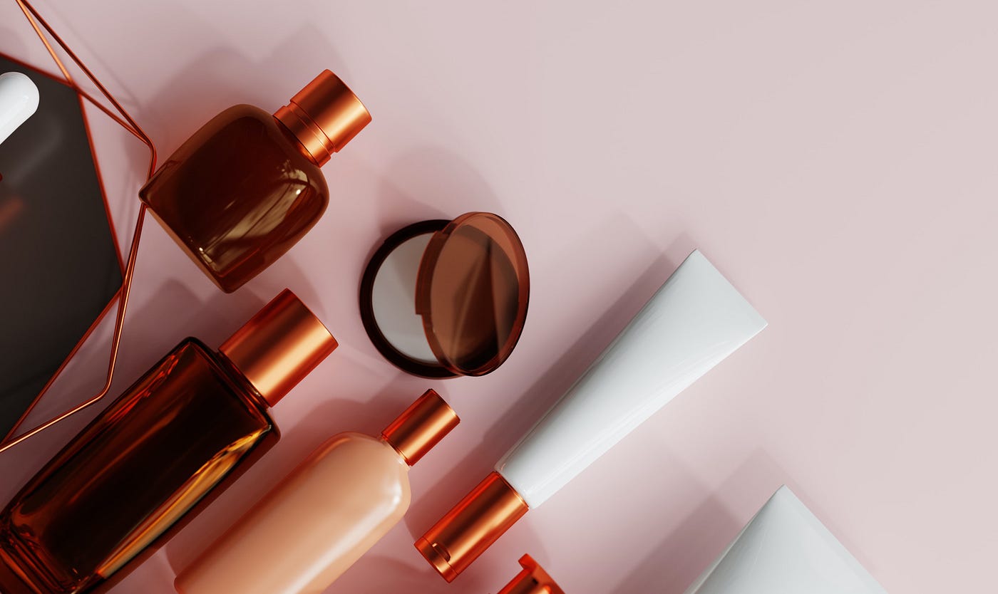 A range of health and beauty products in bottles and tubes displayed on a pale pink background.