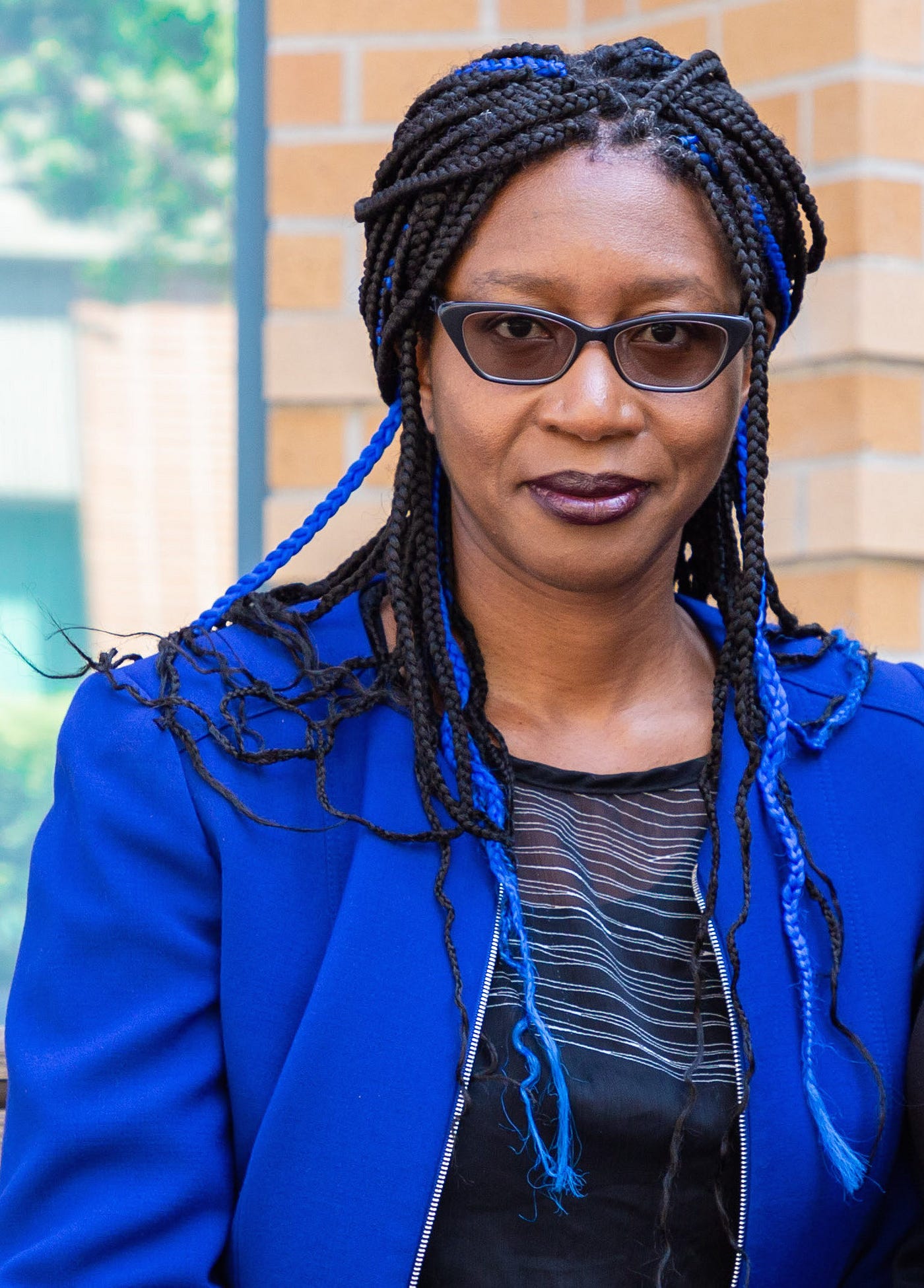 A head shot of Tiffany Willoughby-Herard standing outside of Humanities Gateway