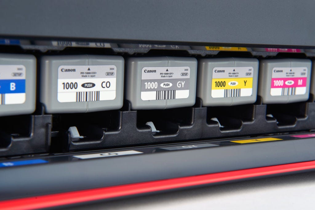 Canon ink cartridges in a printer.