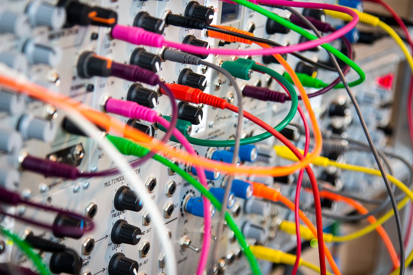 An electrical system with a very hairy number of wires connected to its front panel