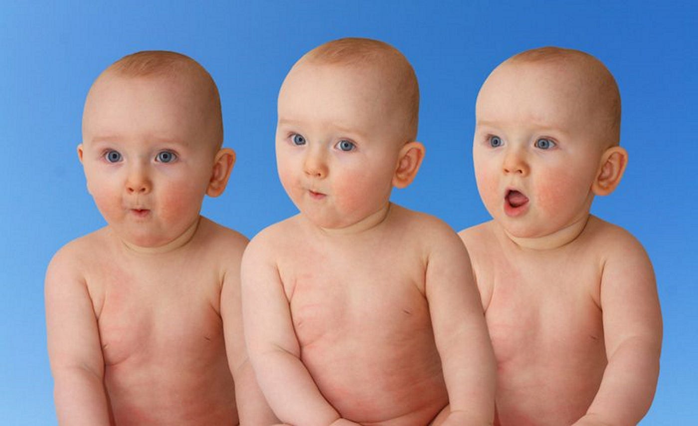 identical triplet babies