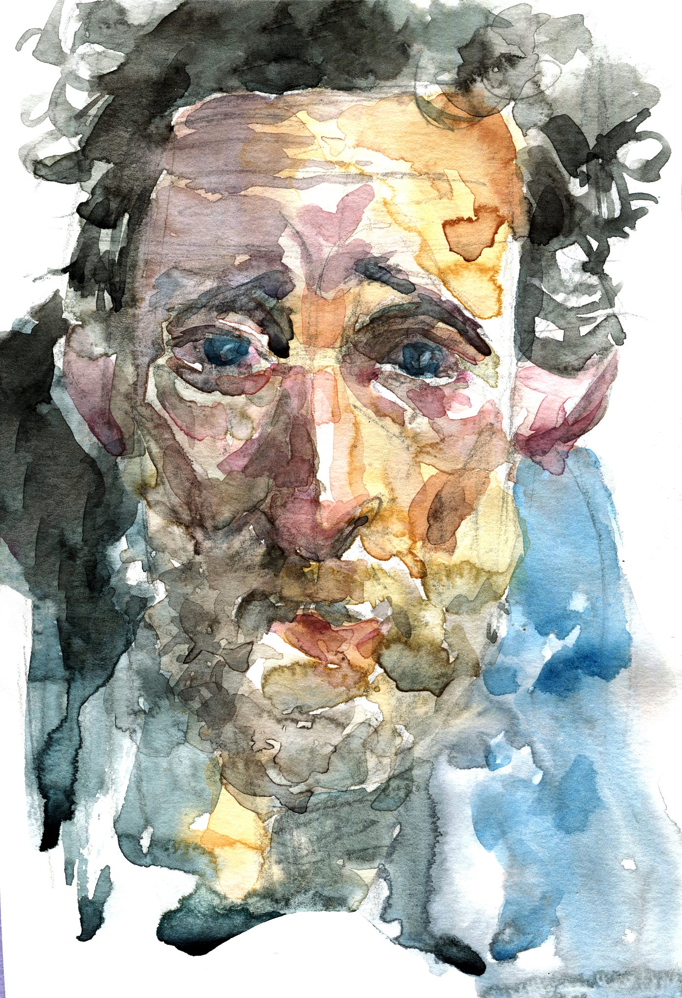 Middle-aged man with beard and blue, blood-shot eyes.
