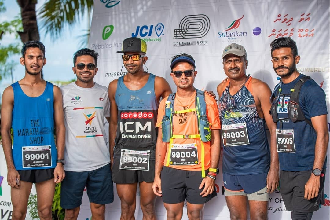 A picture of Addu Marathon 100k runners along with the Race Director