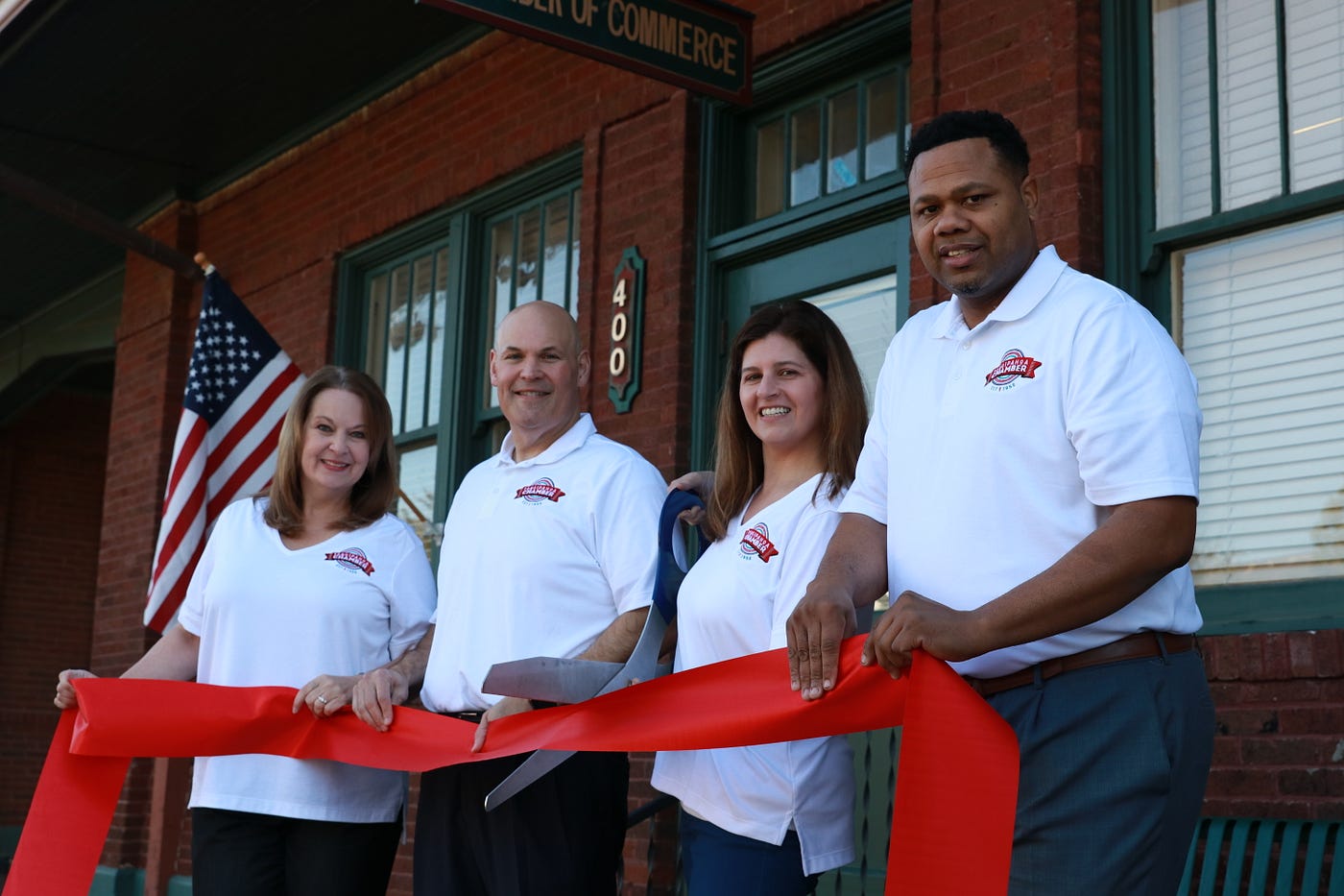 Chamber members getting ready for a ribbon cutting