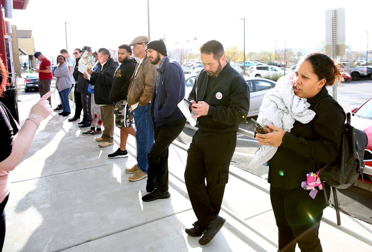 Group of unemployed losers standing around doing nothing.