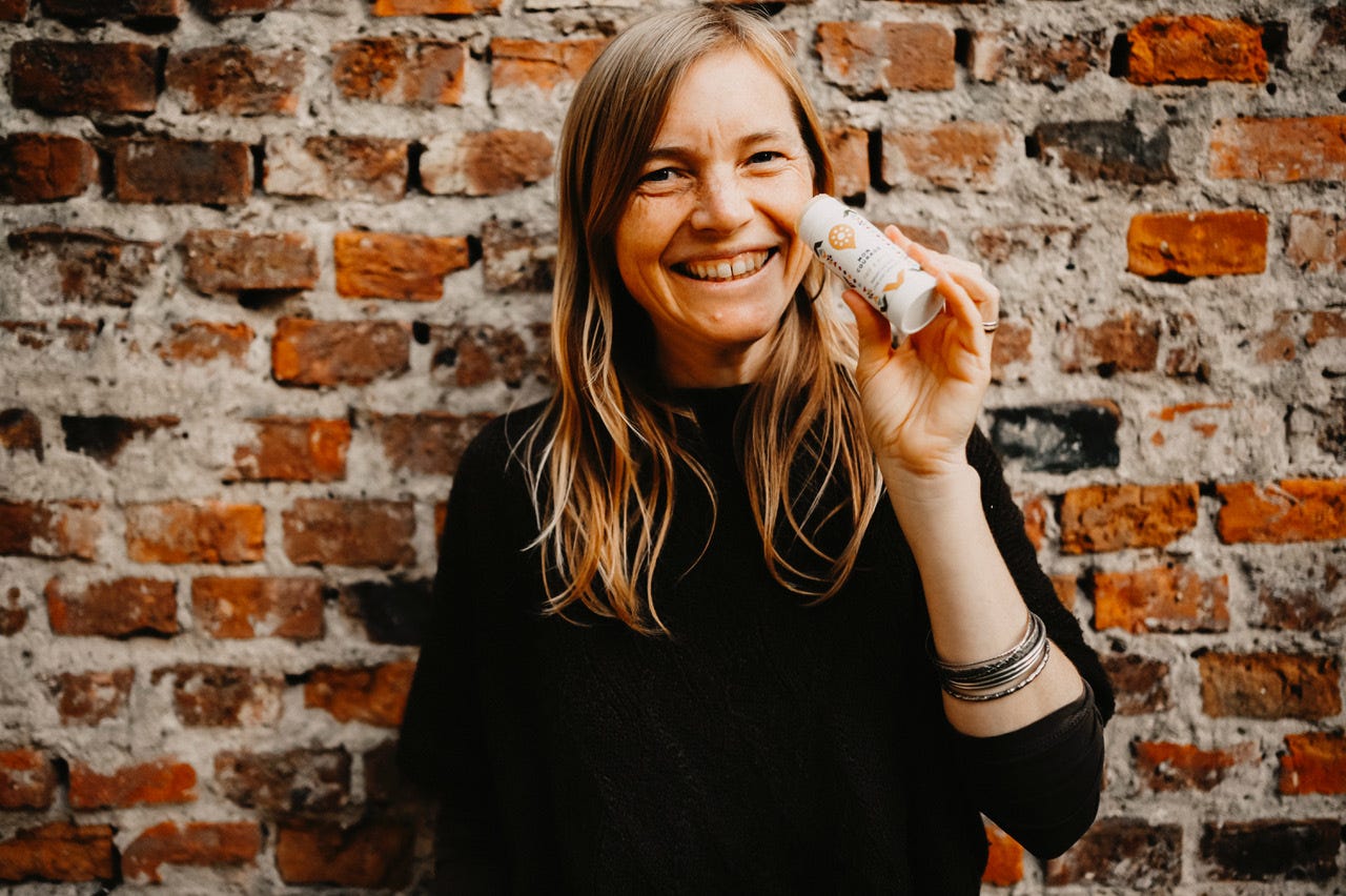 A photo of founder Eva Helmeth and her MON COURAGE Face & Body Stick.