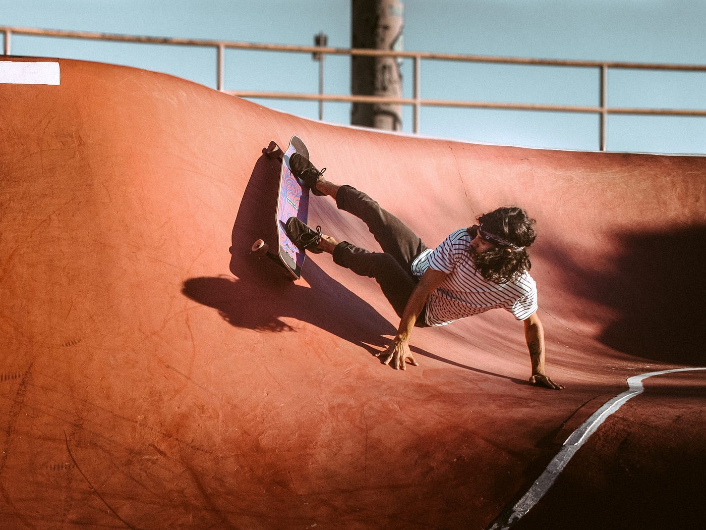 A person falling on their skateboard.
