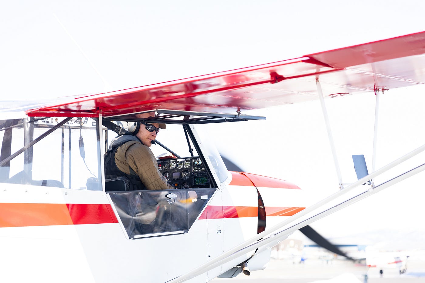 Man in a small plane looking out