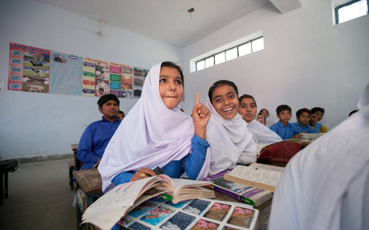 Tooba Sharif (name changed), a sixth grade Oxfam scholarship recipient, studies in class, Pakistan. Photo: Khaula Jamil/Oxfam