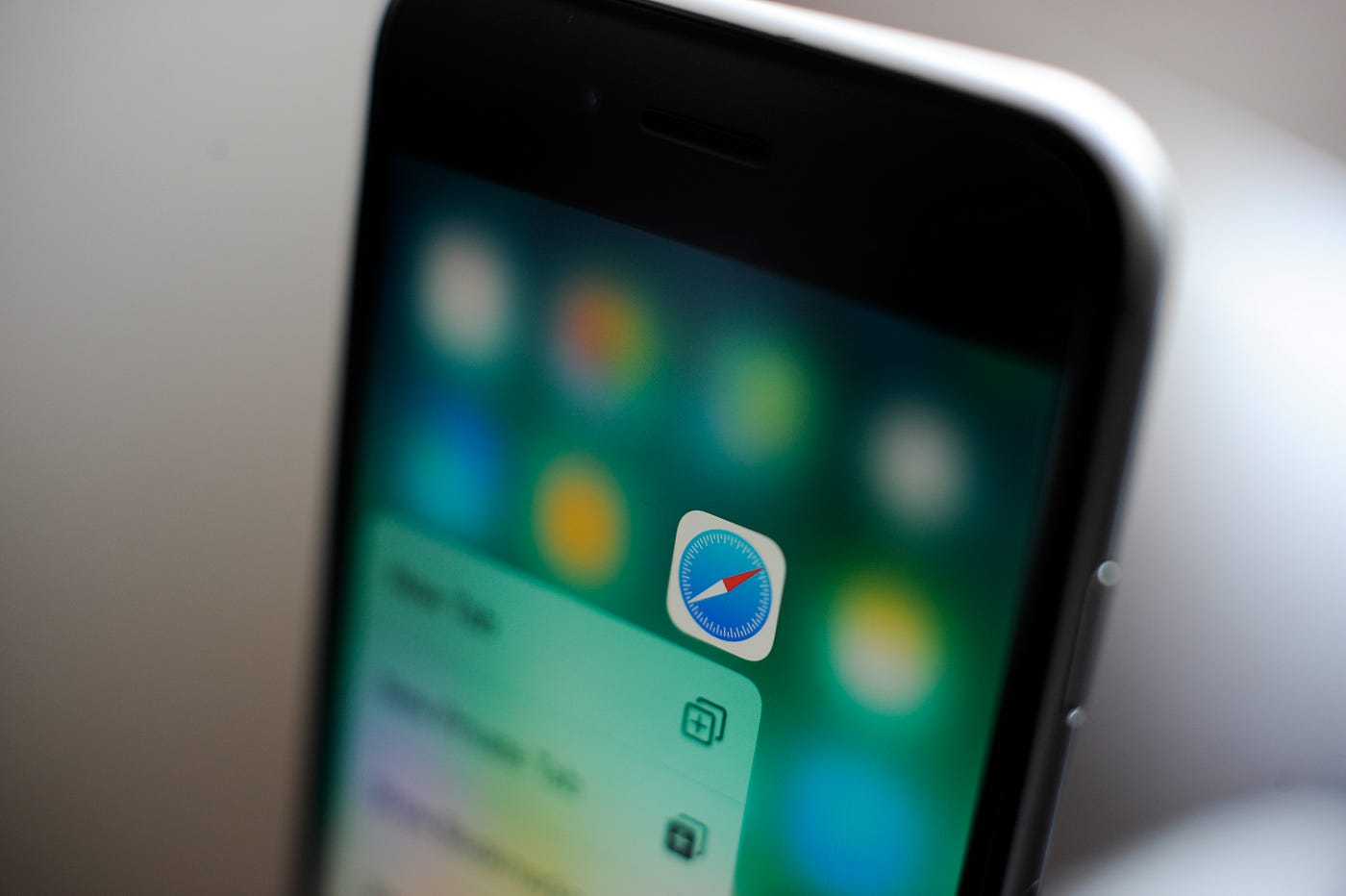 A photo of the Safari app icon on an iPhone.