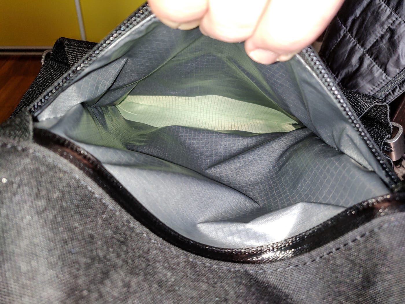 Pocket pushed back in, tape visible at bottom.
