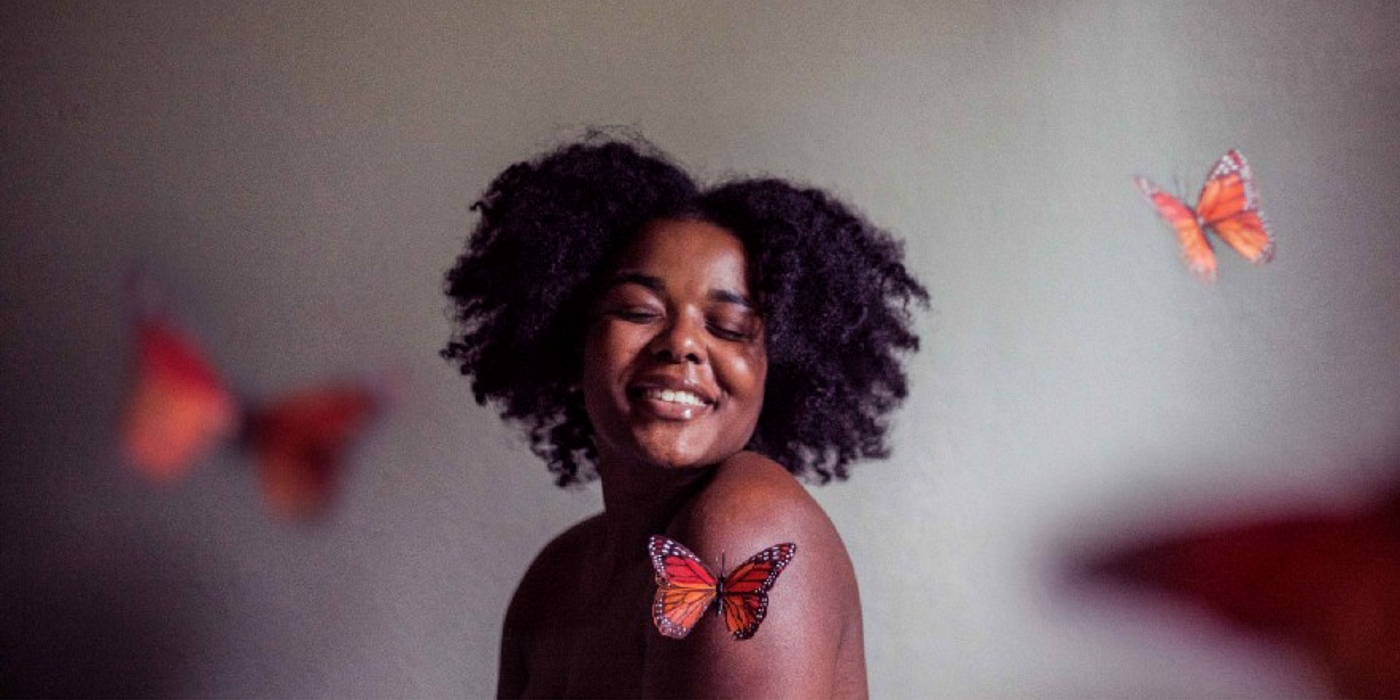 Photo by Jessica Felicio on Unsplash | Black girl surrounded by butterflies