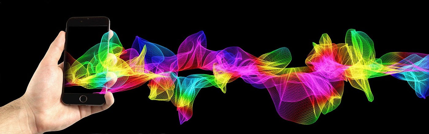 The spectrum of light colours flowing from a Smartphone — The Anatomy of a Creative Storytelling Logo by Paul Myers