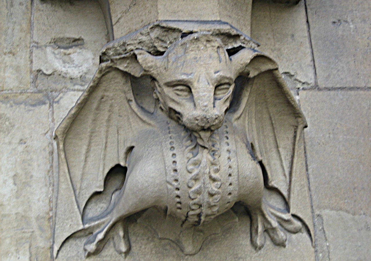 A stone dragon on a building in London, England