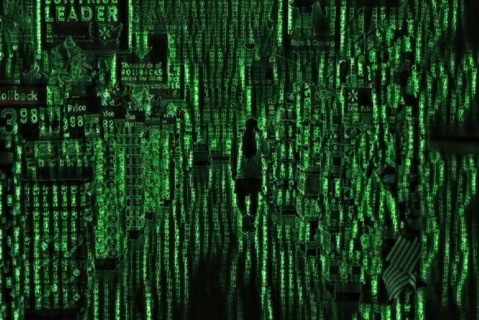 An image of a supermarket aisle that has that a filter reminiscent of the matrix on it. Alphabetic characters make up the structure of the image.