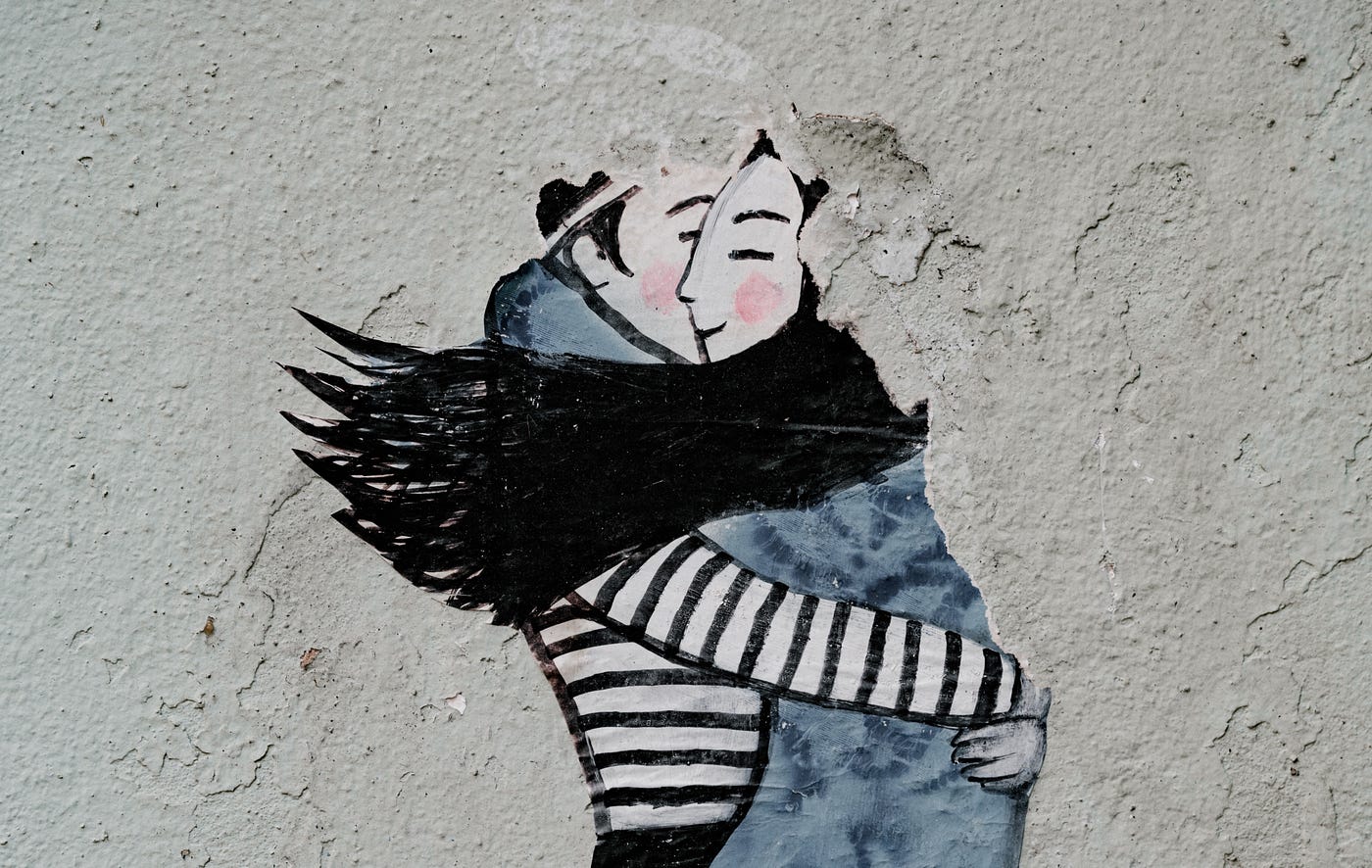 Man hugging a woman wall painting