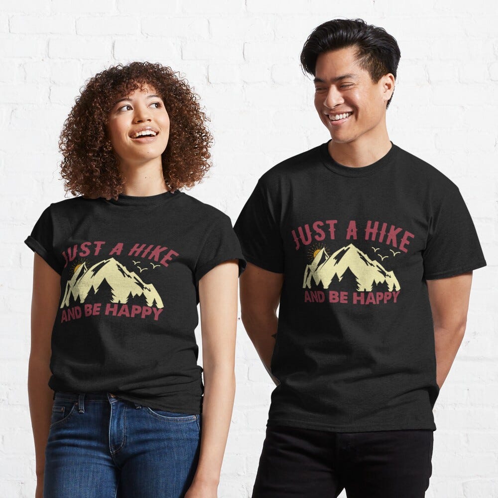 Man and Woman Wearing a black classic t-shirt with amazing illustration and text saying “just a hike and be happy”.