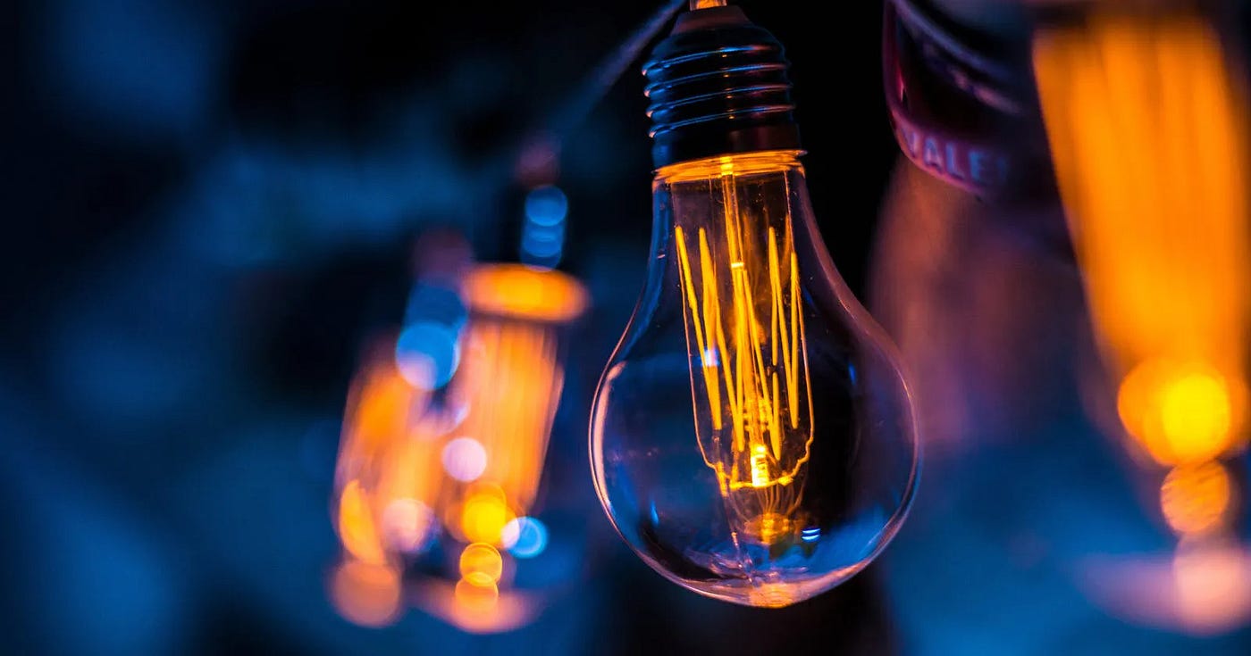 Edison light bulbs against a blue background