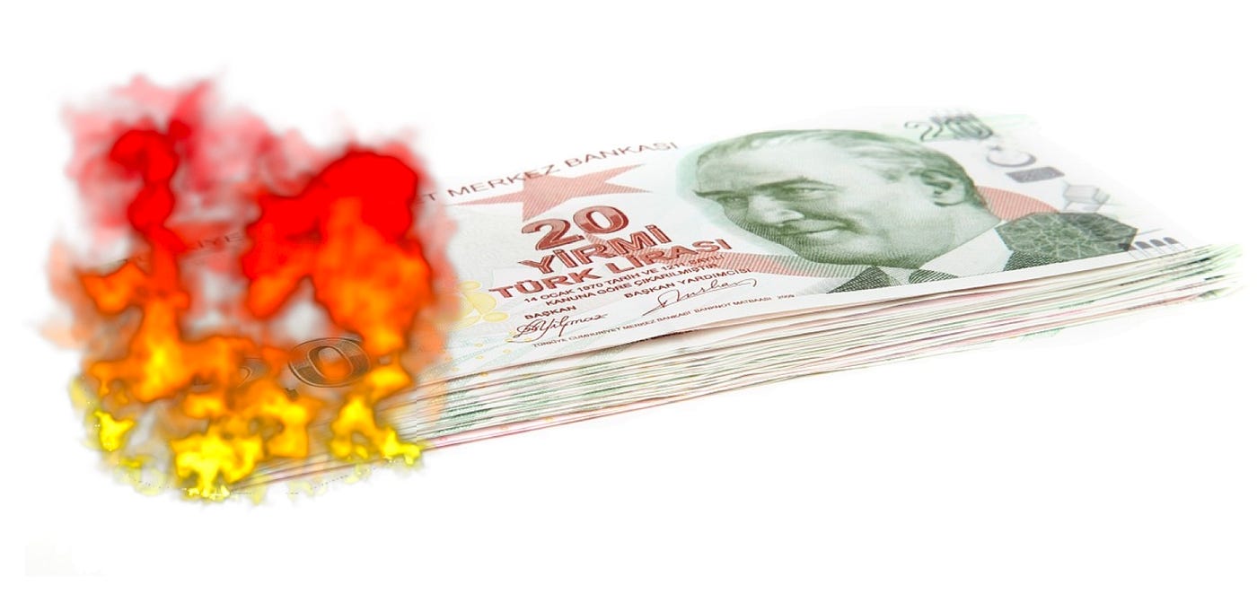 IMAGE: A stack or Turkish lira bank notes burning