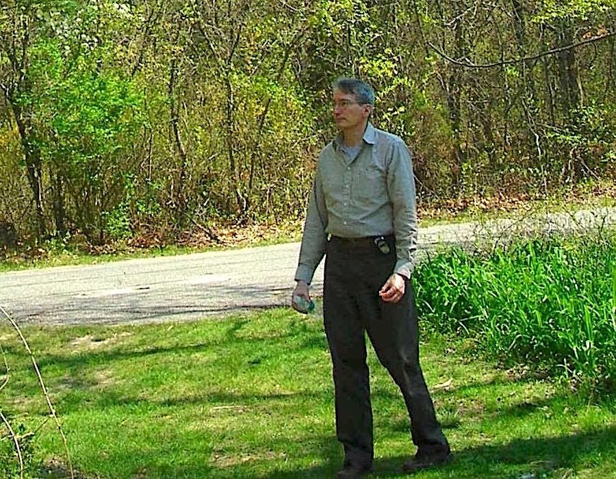 Glenn walking in woods