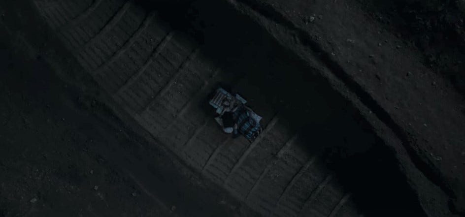 Above shot of Edith and Robert lying in the ship