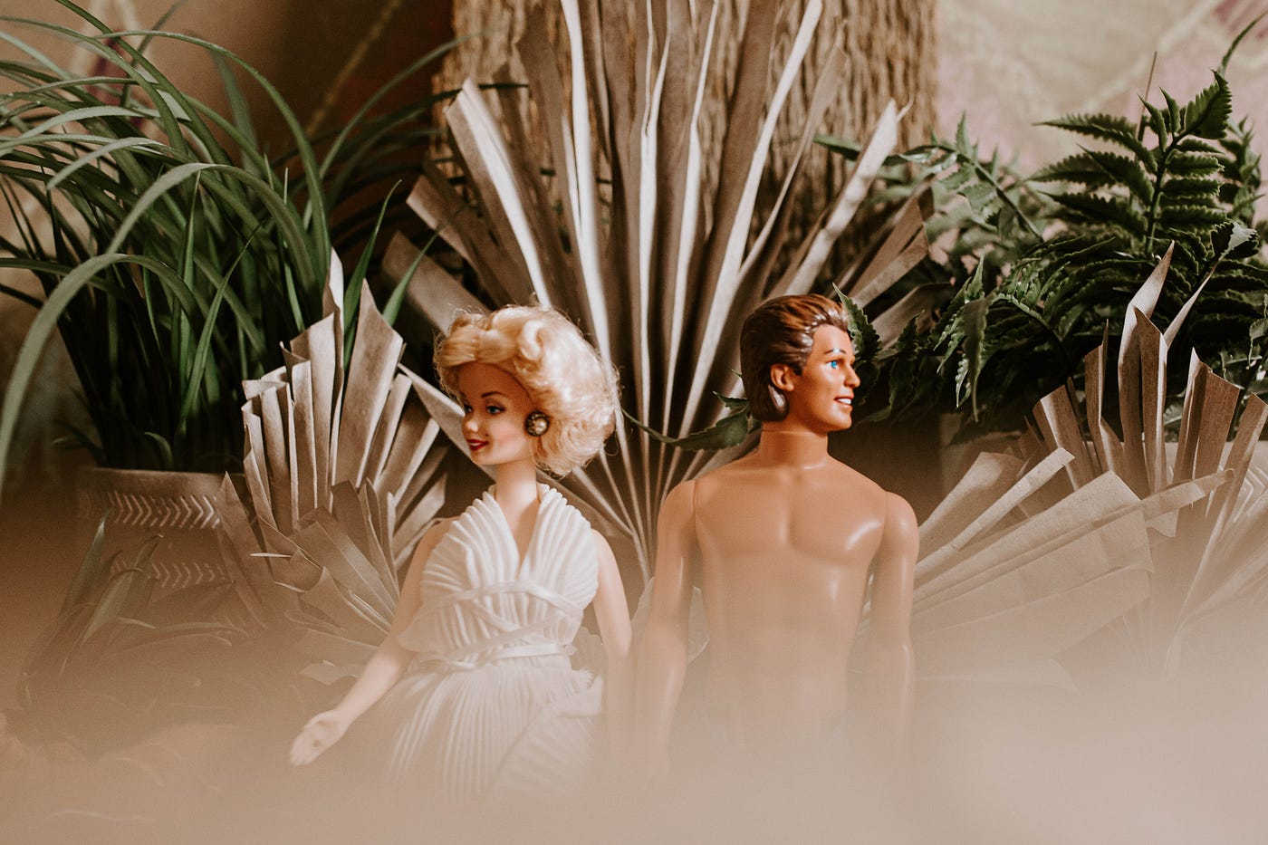 Plastic dolls, Barbie and Ken, with plants in the background, Keri Mangis, Medium