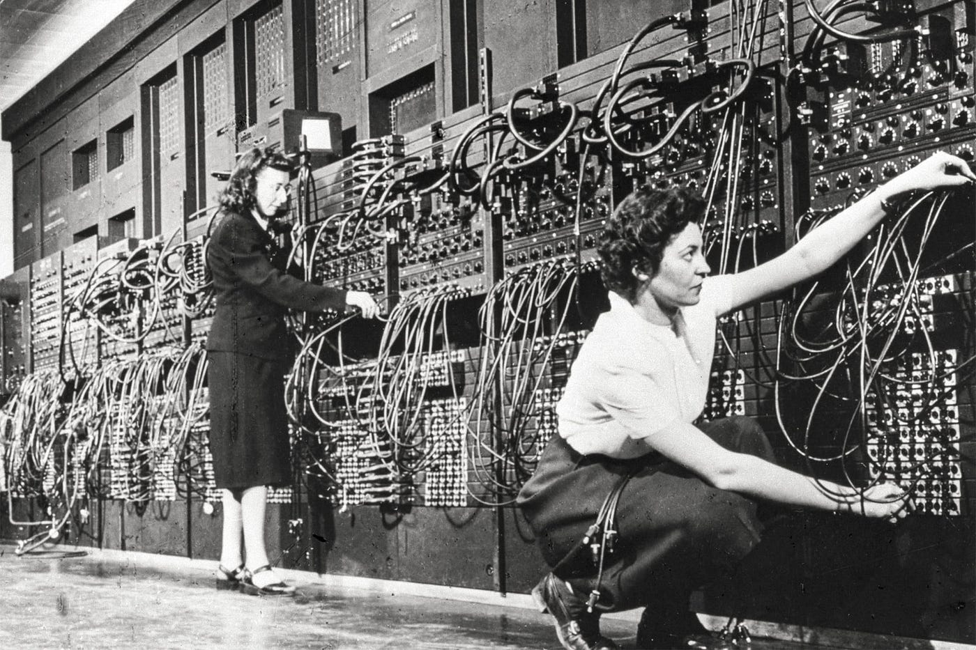Two “hidden figures”, programmers Marlyn Wescoff and Ruth Lichterman, plugging cables in at the plugboard of the ENIAC