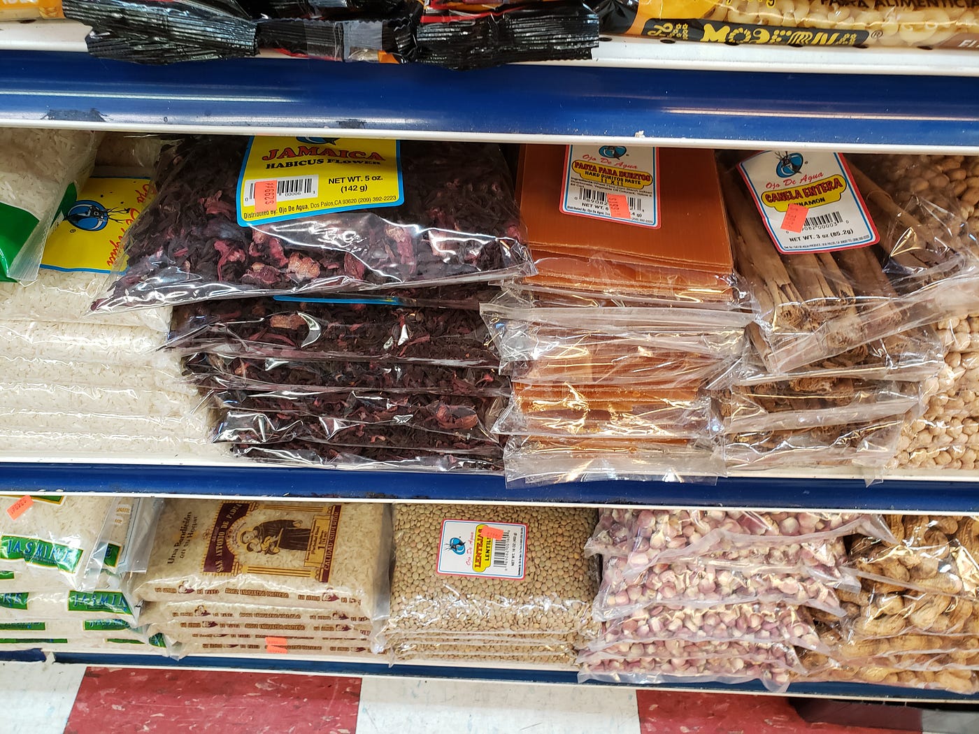 Dried goods: jamaica (hibiscus), durito sheets, cinnamon sticks, rice, hominy and peanuts at E. 14th Produce