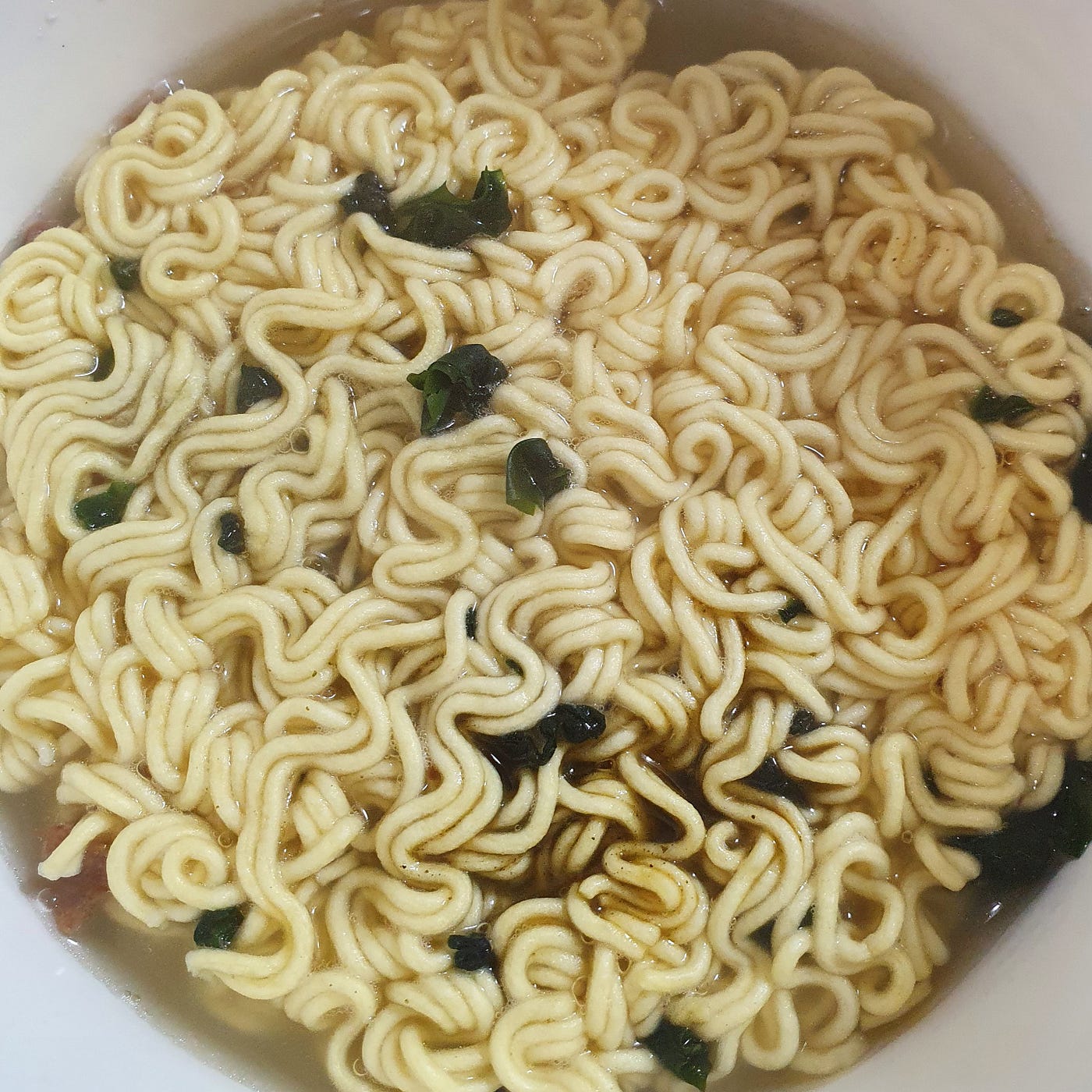 Boiling water poured up to the fill line in a cup of Ottogi Sogogi Miyeokguk Ramen.