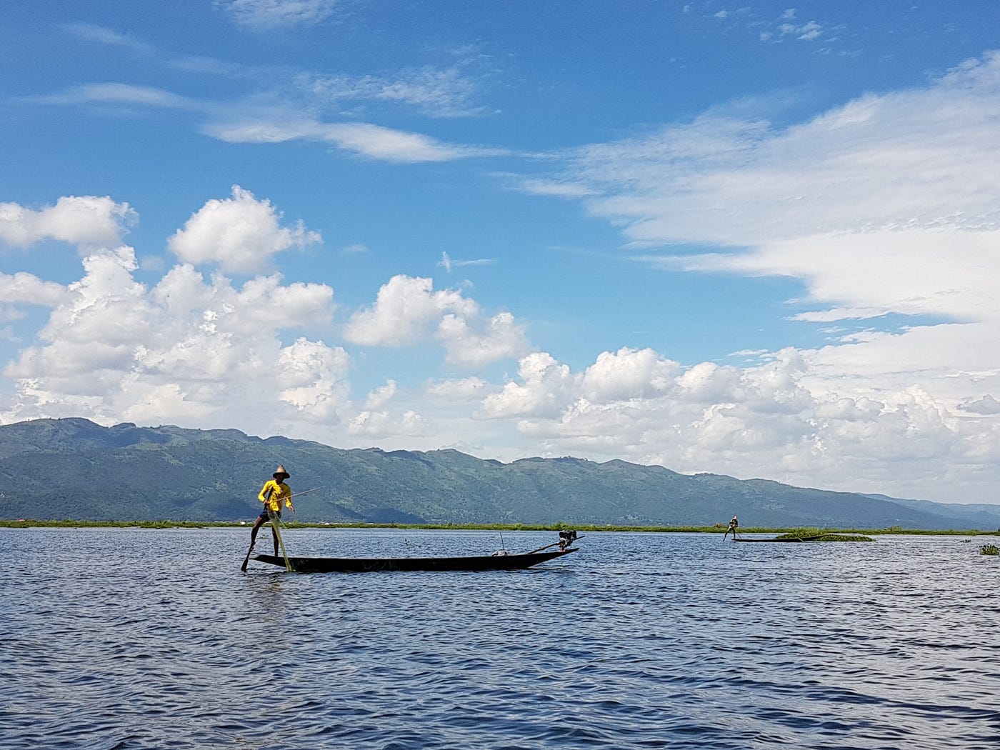 Photo of a fisherman on the Inle lake posing in the cliché way ... yes, after taking the photo he came over to ask for the tourist fee of taking the cliché photo, because he's not really fishing, actually