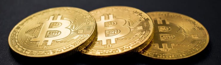 An image of 3 bitcoin mock-ups.