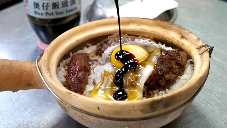 Clay Pot Rice with Lap Cheung and egg topped off with soy sauce.