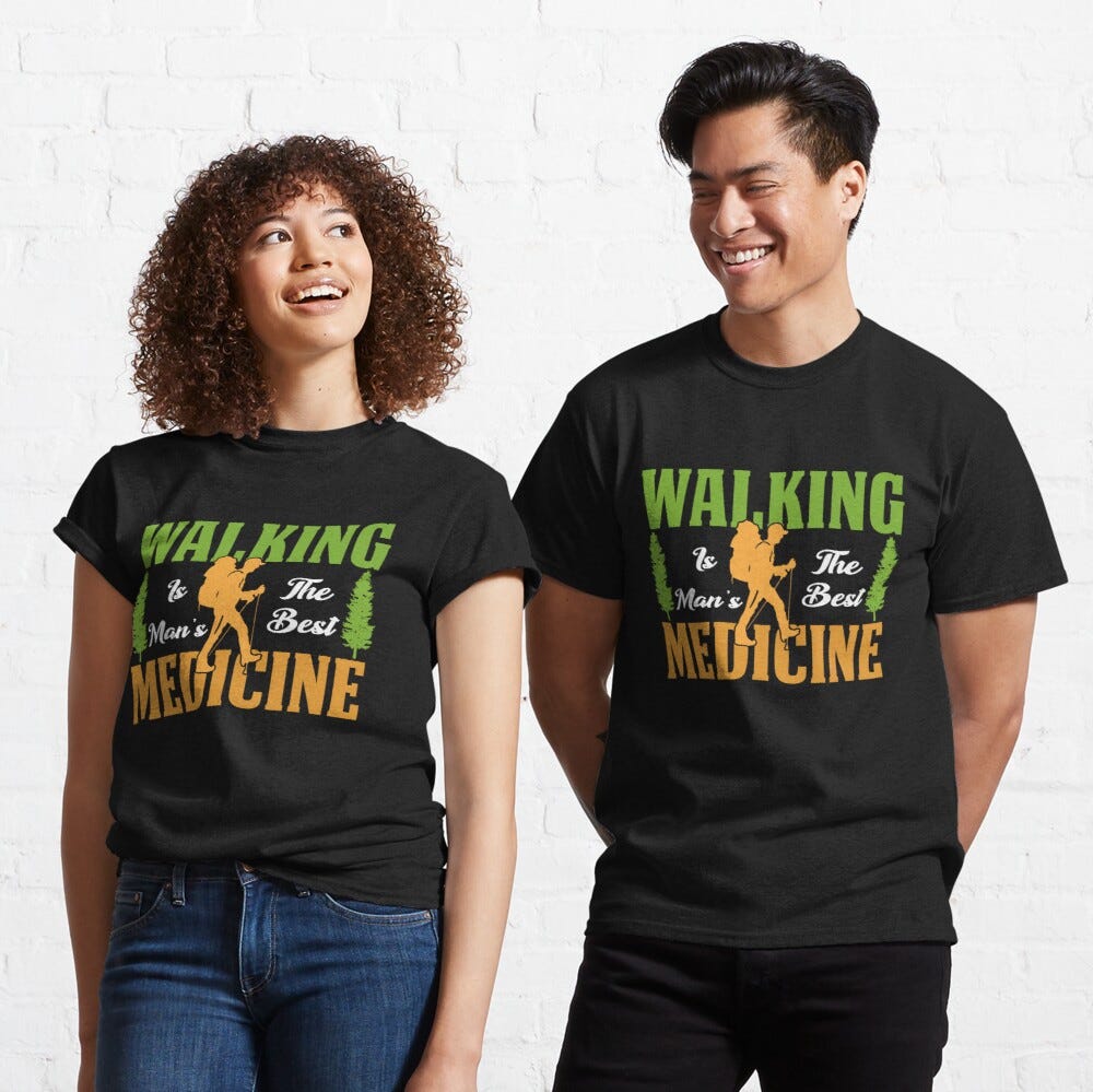 Man and Woman Wearing a black classic t-shirt with amazing illustration and text saying “walking is the man’s best medicine”.
