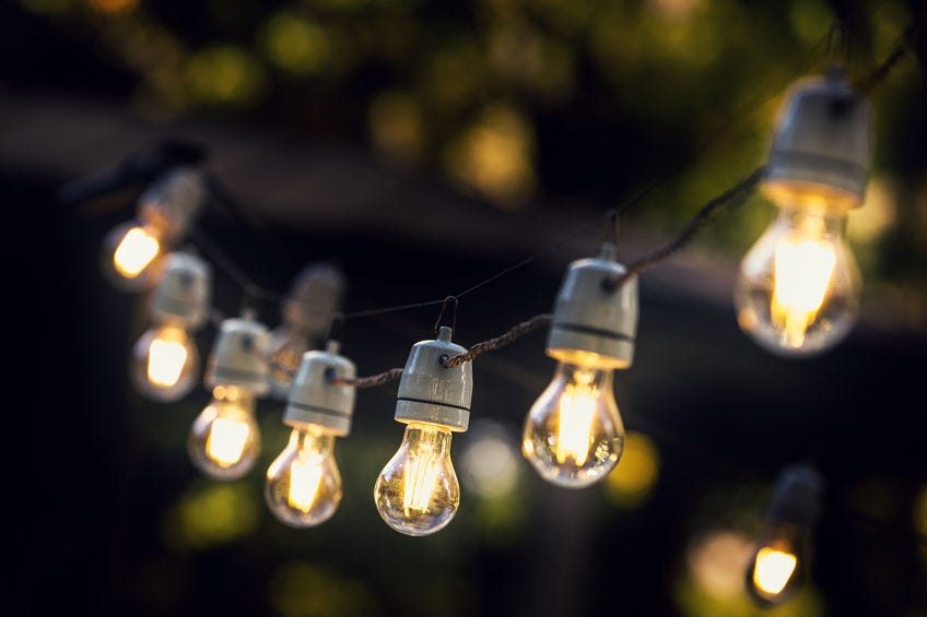 A lit string of outdoor patio lights.