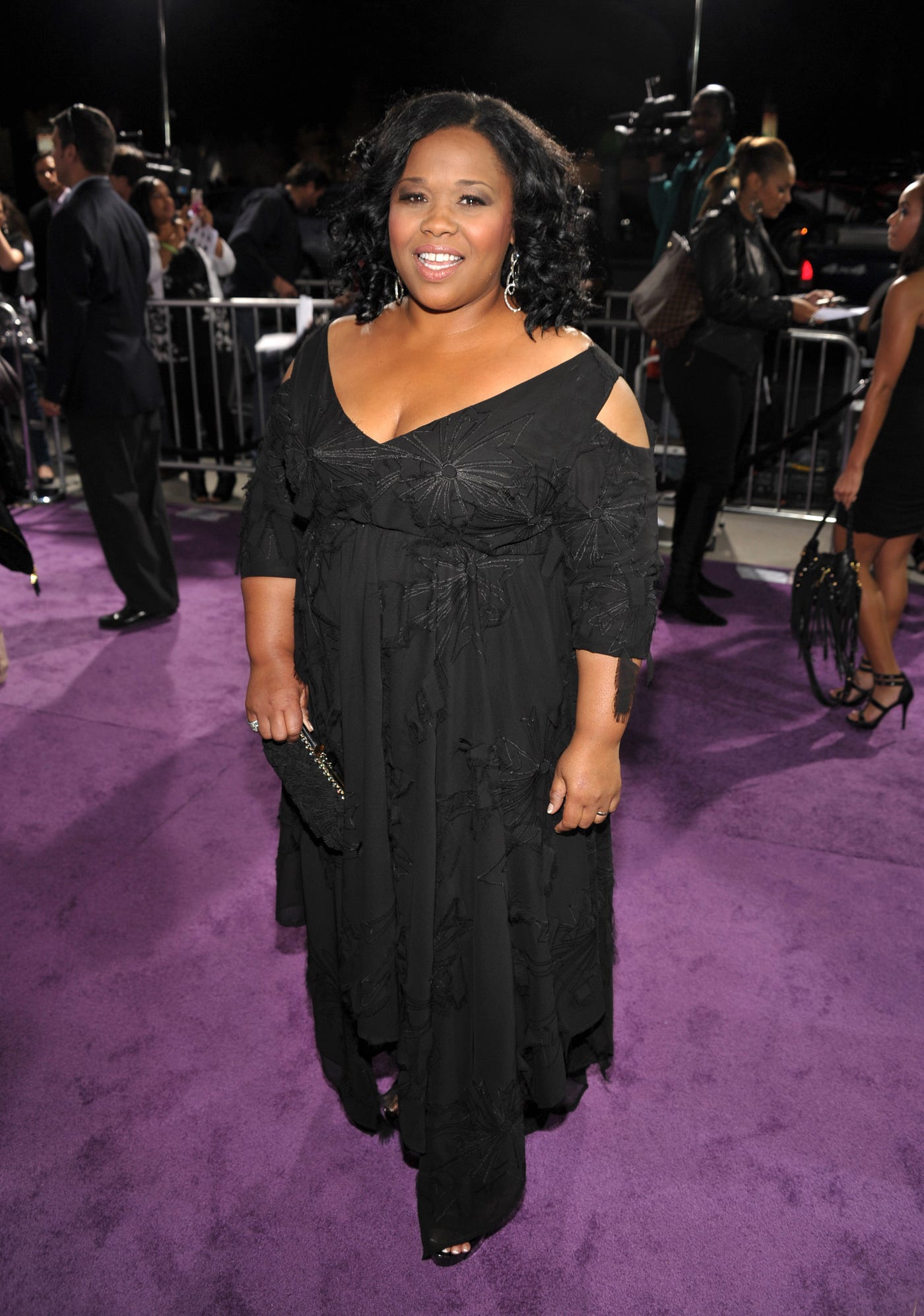 Natalie Desselle wearing a black dress at a movie premiere.