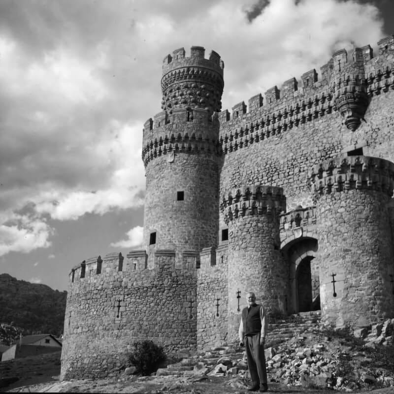 Ernest Hemingway standing by the entrance to the New Castle of Manzanares el Real near Sierra de Guadarrama, circa 1959
