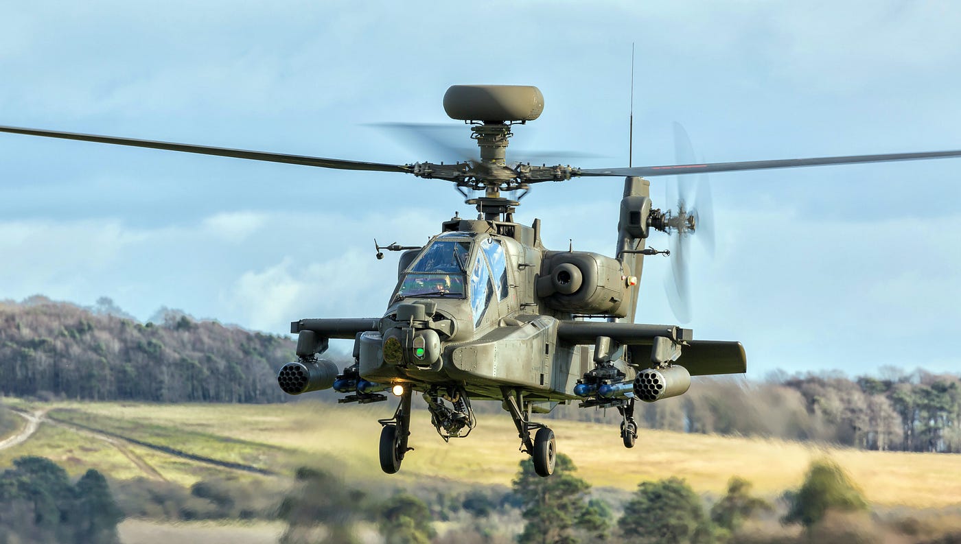 A military helicopter landing in a valley