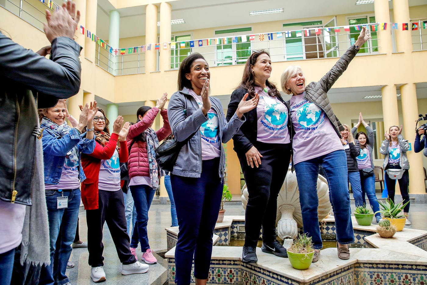 Naikhoba stands with two female leaders of Operation Smile.