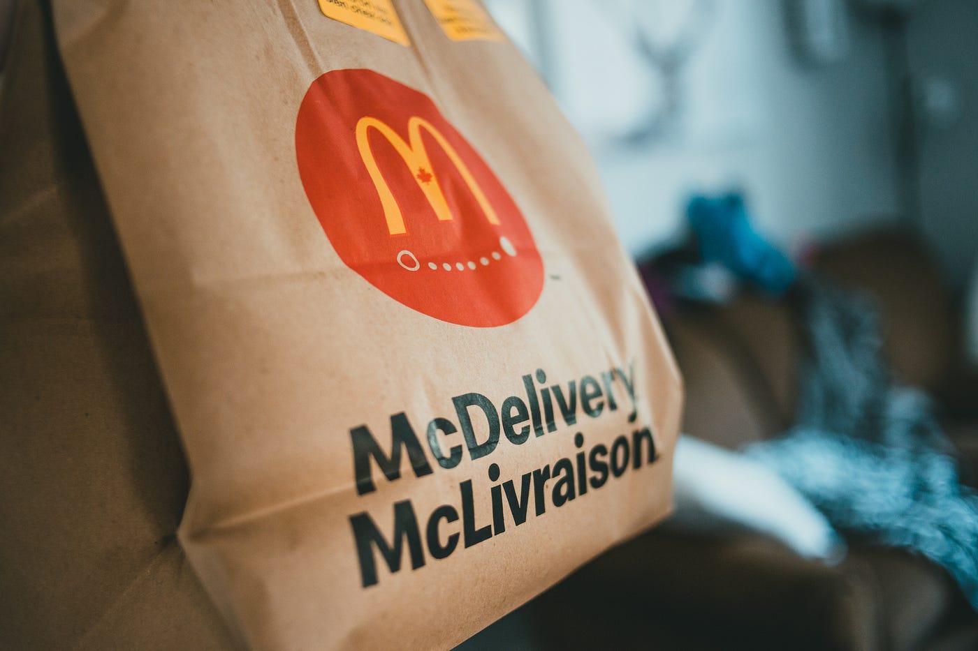 A brown bag with McDonalds logo saying McDelivery