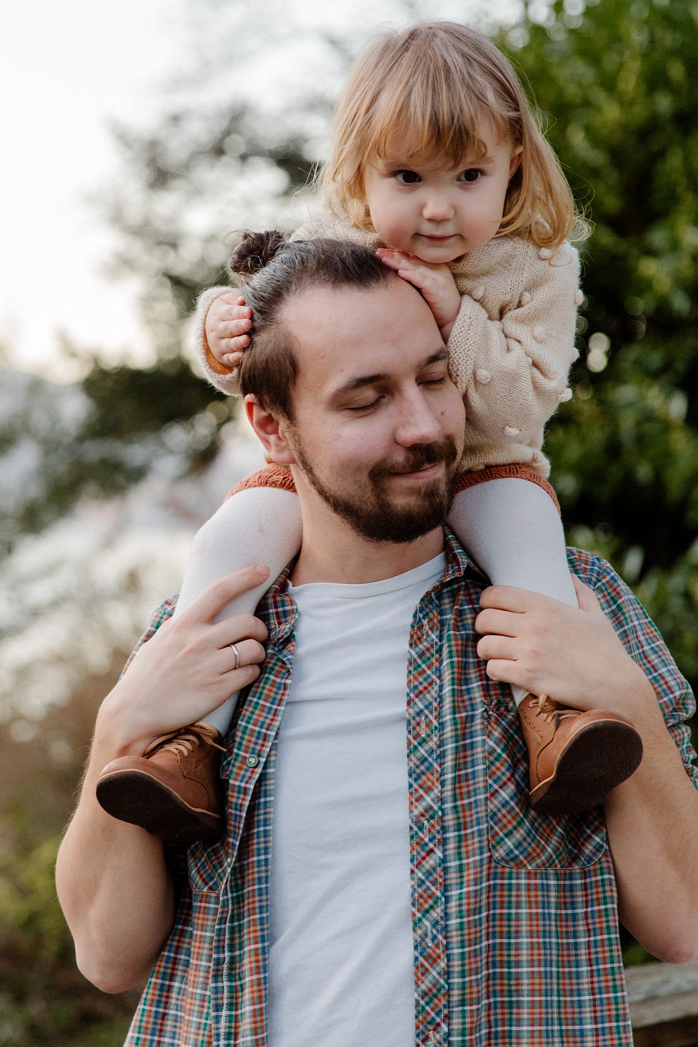 Father giving daughter a shoulder ride